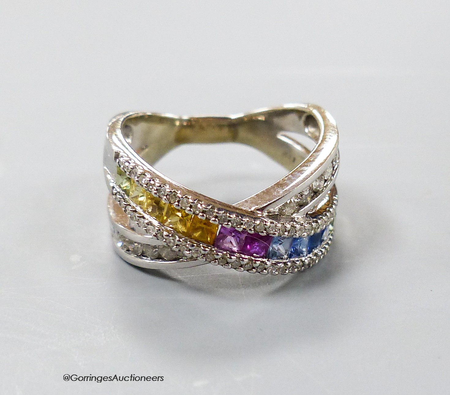 A modern 14ct gold and multi gem set 'X' ring, size O/P, gross weight 7.1 grams.